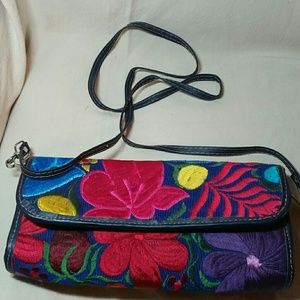 Embroidered clutch with leather strap